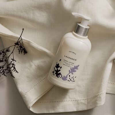 Thymes Lavender Hand Lotion on fabric